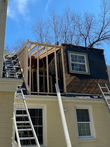 Second floor room expanded, complete with siding, viewing from backyard looking at the roof